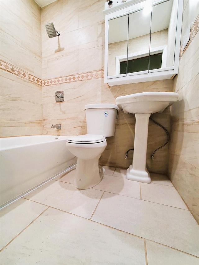 full bathroom featuring tile walls, shower / tub combination, toilet, and tile patterned floors