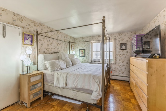 bedroom with parquet flooring and a baseboard radiator