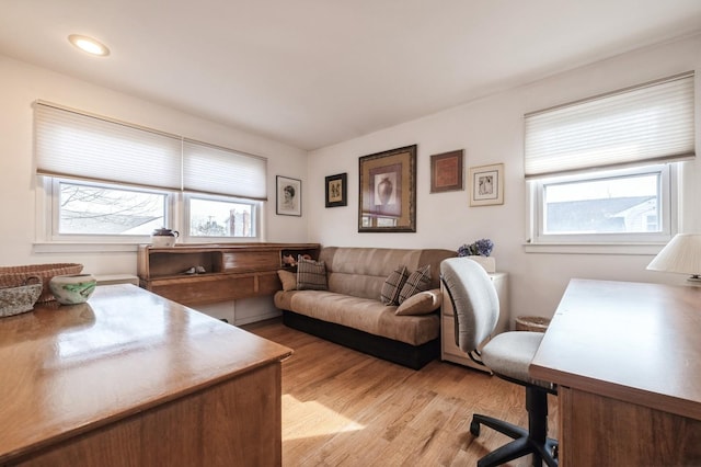 office space with light wood-type flooring