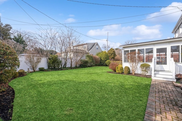 view of yard with a sunroom