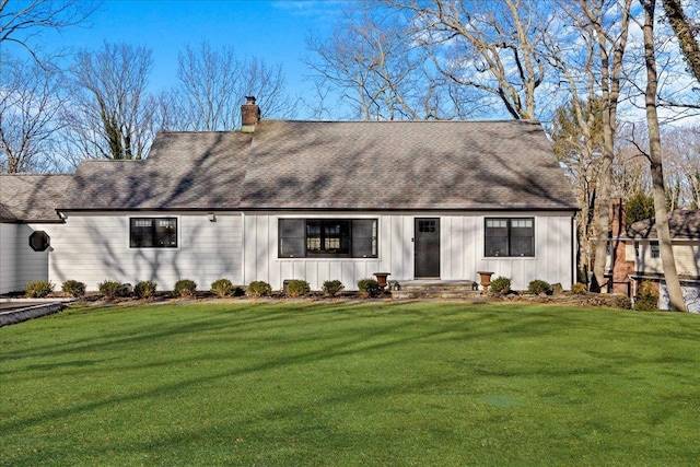 back of house with a yard