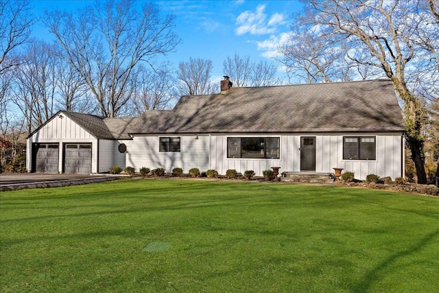 view of front of property with a garage and a front yard