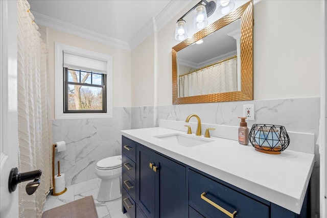 bathroom with ornamental molding, vanity, toilet, and tile walls