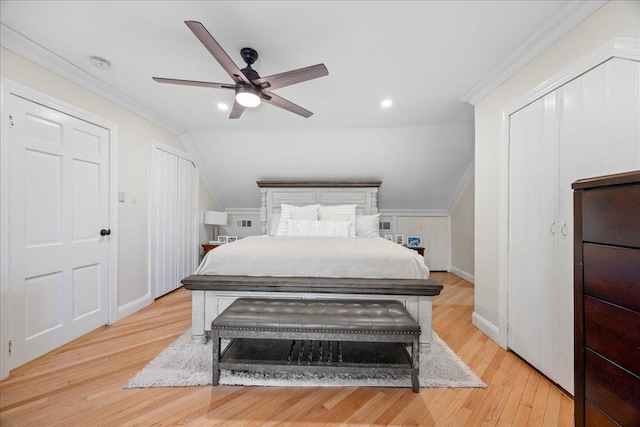 bedroom with crown molding, lofted ceiling, ceiling fan, and light wood-type flooring