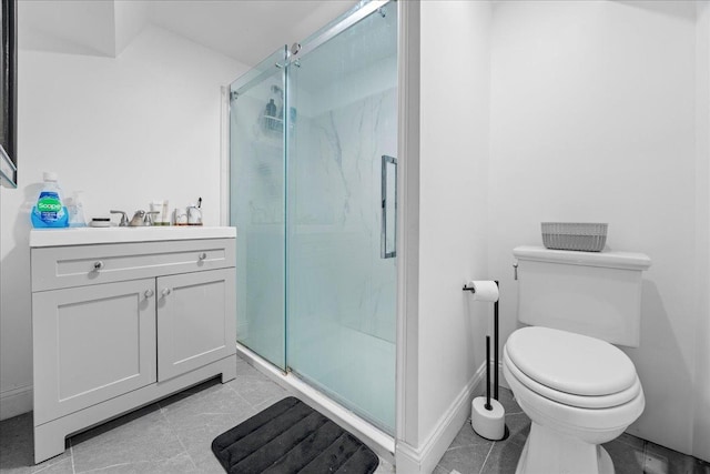 bathroom with vanity, an enclosed shower, and toilet