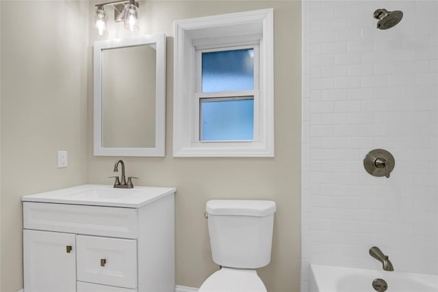 full bathroom featuring vanity, toilet, and tiled shower / bath combo