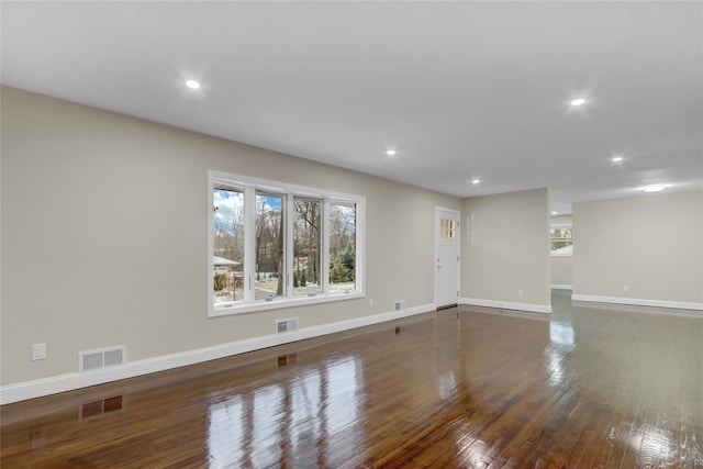 empty room with dark hardwood / wood-style floors