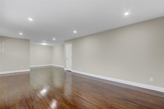 empty room with dark wood-type flooring