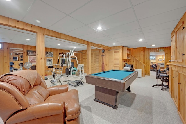 game room with light carpet, pool table, and wood walls