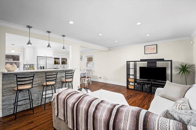 living room with ornamental molding, recessed lighting, dark wood finished floors, and baseboards