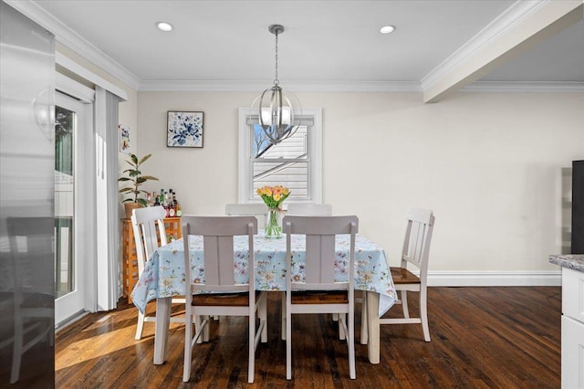 dining room with ornamental molding, dark wood-type flooring, recessed lighting, and an inviting chandelier