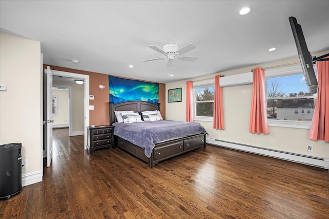 bedroom featuring dark wood-style floors, a baseboard radiator, recessed lighting, a wall mounted AC, and baseboards