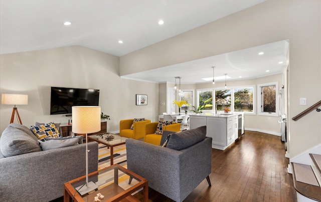 living room with lofted ceiling and dark hardwood / wood-style floors