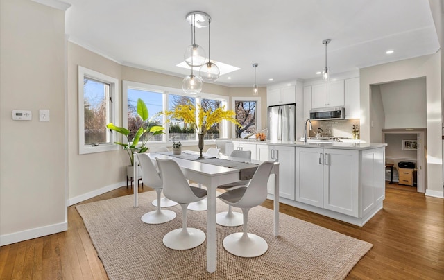 dining room featuring crown molding and hardwood / wood-style floors