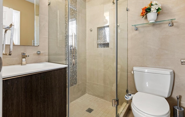 bathroom featuring tile walls, backsplash, vanity, toilet, and walk in shower