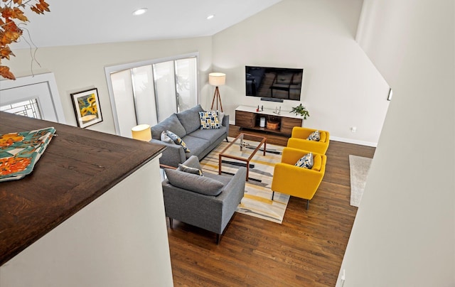 living room with lofted ceiling and dark wood-type flooring