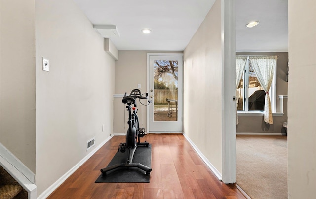 workout room with wood-type flooring