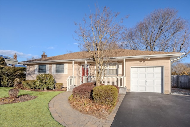 single story home featuring a garage and a front yard