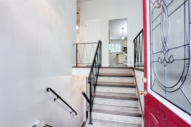 28 Robin Hood Rd, Montebello, NY 10901 - stairway featuring wood finished floors