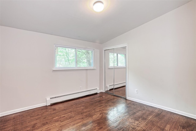 28 Robin Hood Rd, Montebello, NY 10901 - unfurnished room featuring baseboard heating, vaulted ceiling, and wood finished floors