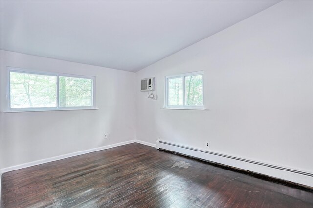 28 Robin Hood Rd, Montebello, NY 10901 - unfurnished room featuring baseboard heating, lofted ceiling, dark wood finished floors, and a wall mounted air conditioner