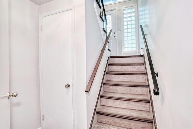 28 Robin Hood Rd, Montebello, NY 10901 - staircase featuring wood finished floors and baseboards