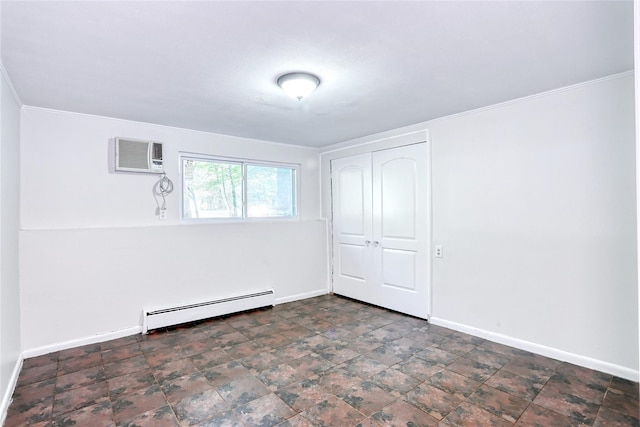 28 Robin Hood Rd, Montebello, NY 10901 - spare room featuring baseboard heating, a wall unit AC, and ornamental molding