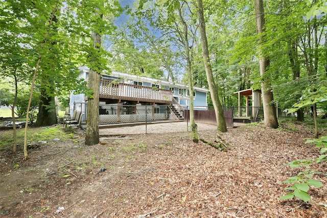 28 Robin Hood Rd, Montebello, NY 10901 - back of property with a deck and stairway