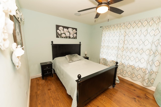 bedroom featuring wood-type flooring and ceiling fan