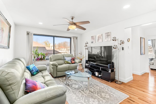 living room with recessed lighting, baseboards, light wood-style floors, and ceiling fan