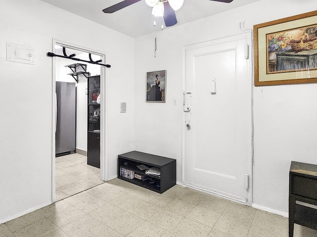 entryway featuring ceiling fan