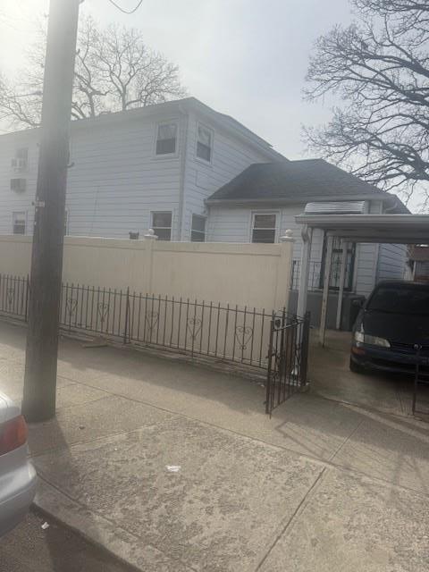 view of property exterior featuring a carport