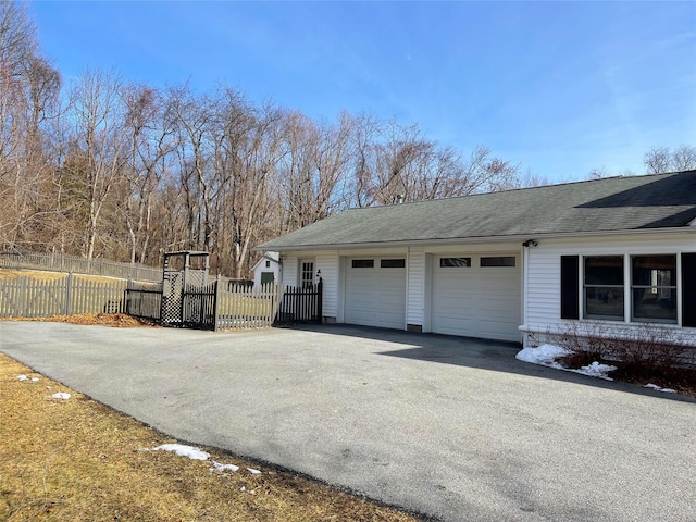 view of side of home with a garage