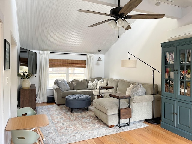 living room featuring vaulted ceiling with beams, light hardwood / wood-style flooring, an AC wall unit, and ceiling fan