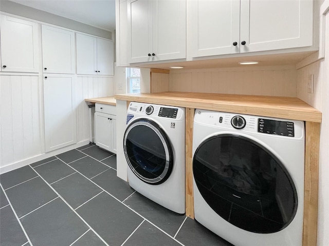 laundry room with cabinets and washing machine and dryer