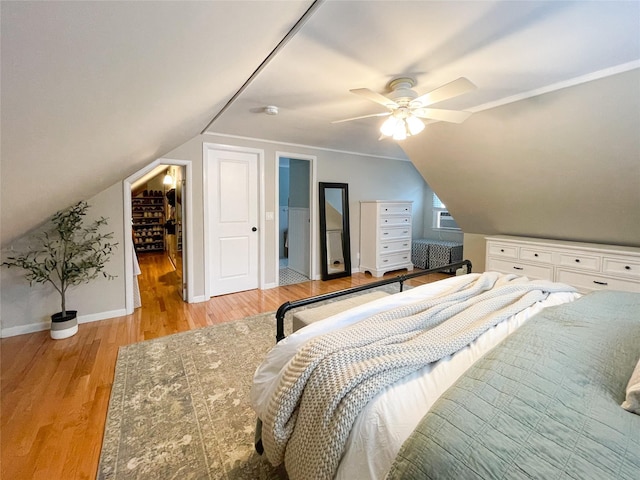 bedroom featuring ceiling fan, lofted ceiling, and light hardwood / wood-style floors