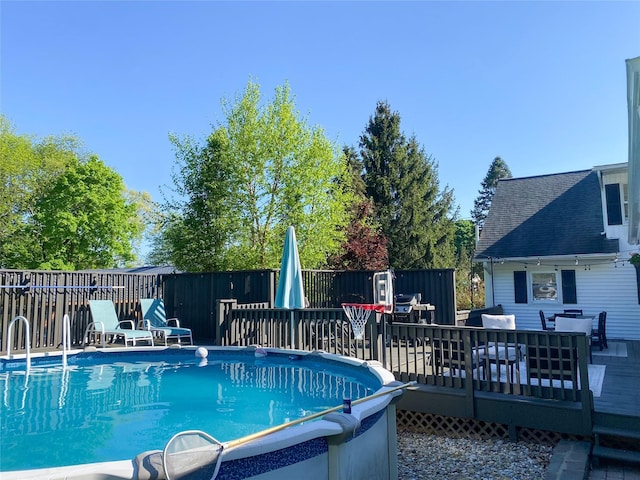 view of pool with a wooden deck