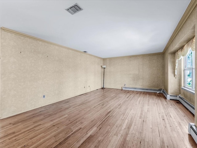 empty room with ornamental molding, a baseboard radiator, and light hardwood / wood-style flooring