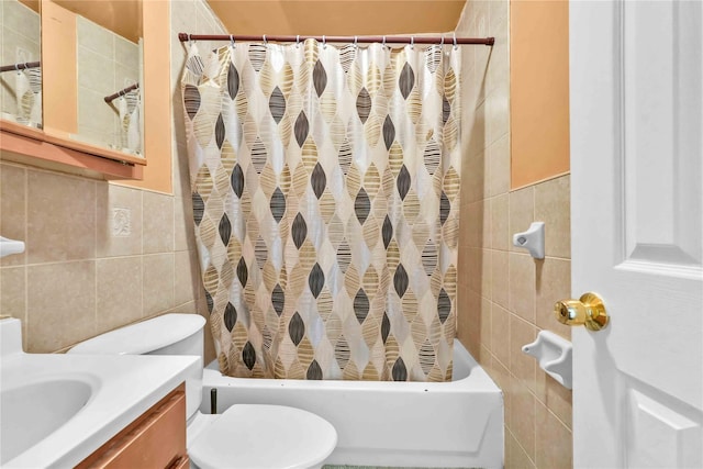 full bathroom featuring tile walls, vanity, toilet, and shower / tub combo with curtain