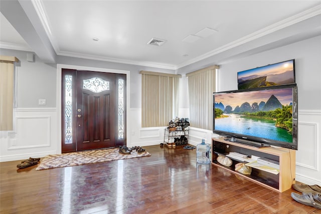 foyer with crown molding and hardwood / wood-style flooring