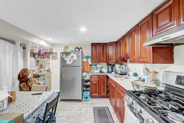 kitchen with appliances with stainless steel finishes and sink