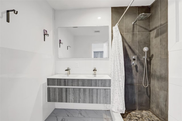 bathroom featuring vanity and a shower with shower curtain