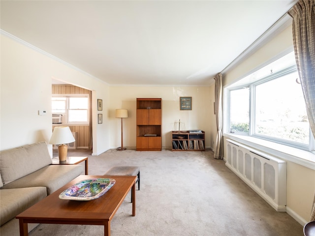 living room with light carpet and ornamental molding