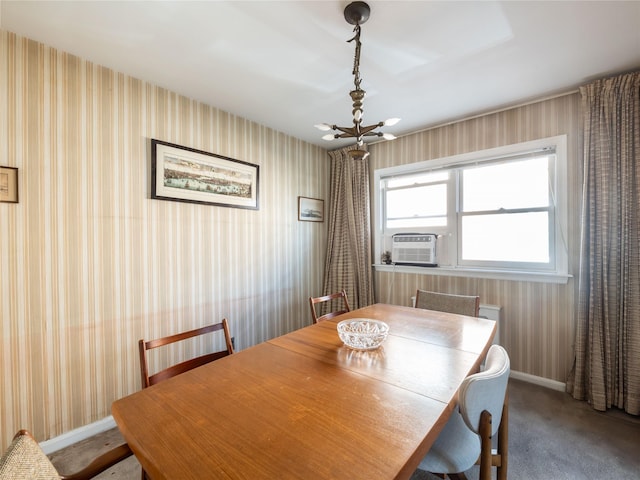 carpeted dining room with cooling unit and an inviting chandelier