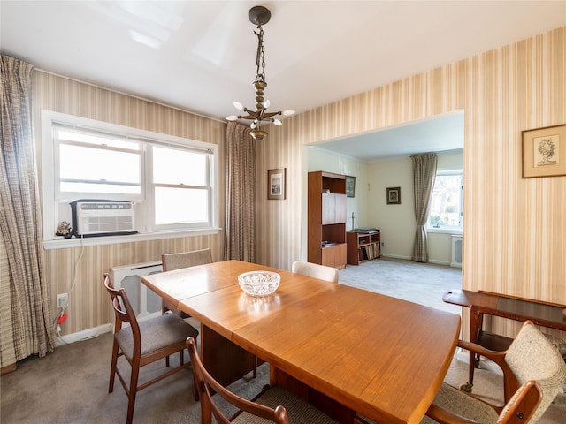 carpeted dining area featuring cooling unit and an inviting chandelier