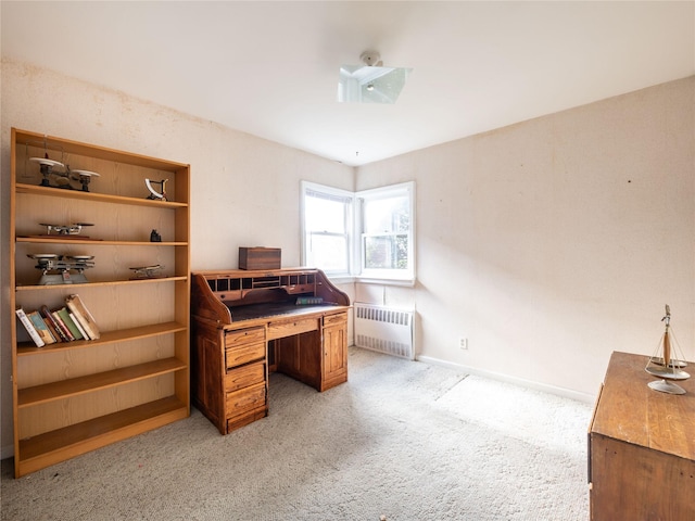 carpeted office featuring radiator