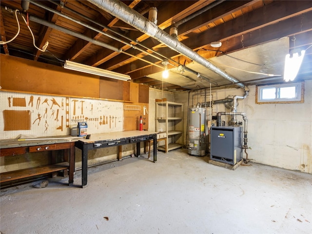 basement with a workshop area and gas water heater