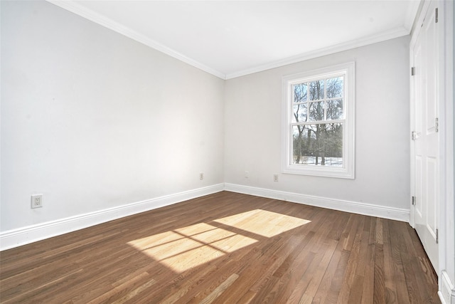 unfurnished bedroom featuring baseboards, ornamental molding, and dark wood finished floors