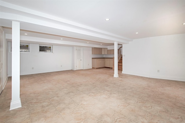 finished basement featuring recessed lighting, stairway, and baseboards