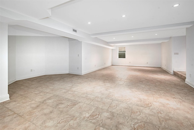 unfurnished room with baseboards, visible vents, beam ceiling, and recessed lighting